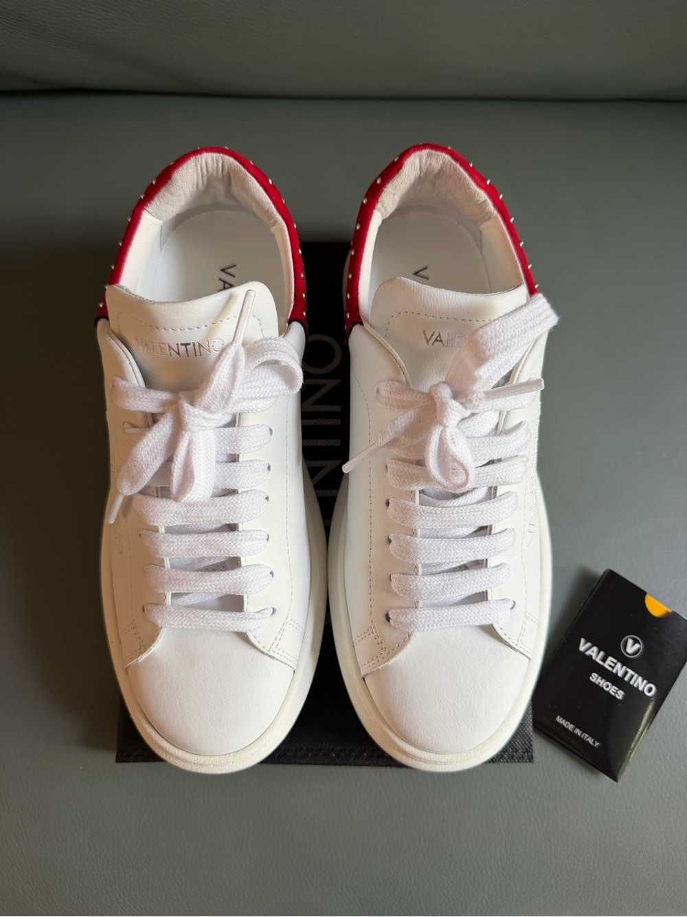 Valentino by Mario White Leather Lace-Up Sneakers with Red Studded Heel.